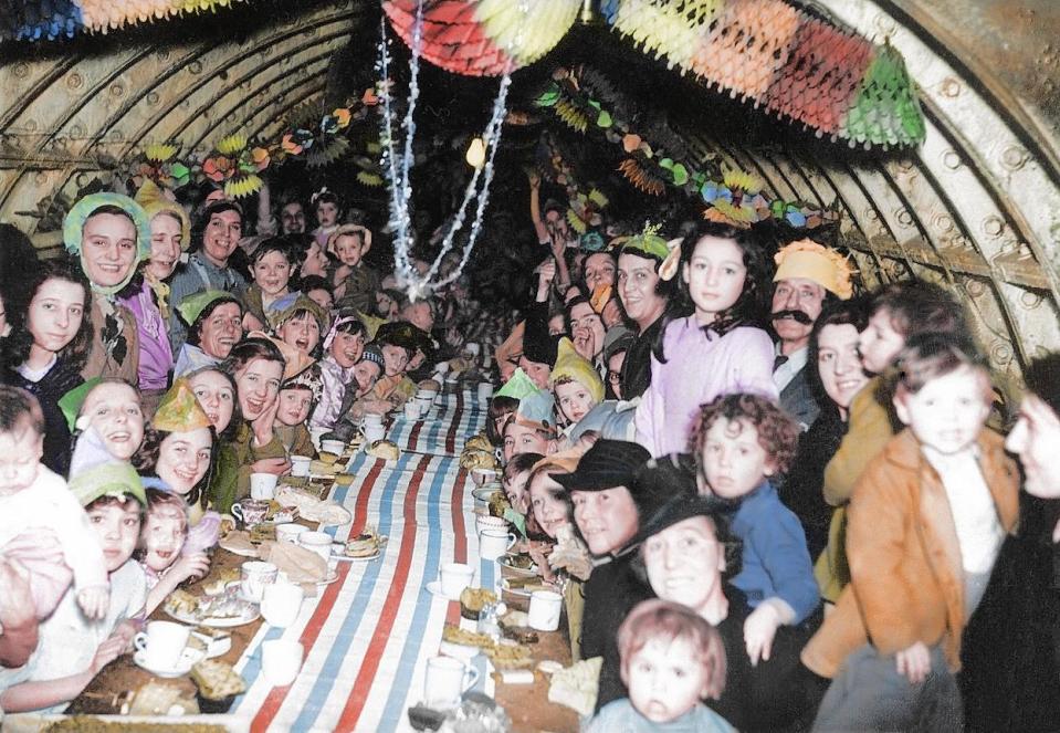  December 25, 1940: Young children are among those celebrating Christmas in an underground bomb shelter. Many spent the Christian festival in the bunkers after the city was bombed for 57 consecutive nights between September and November