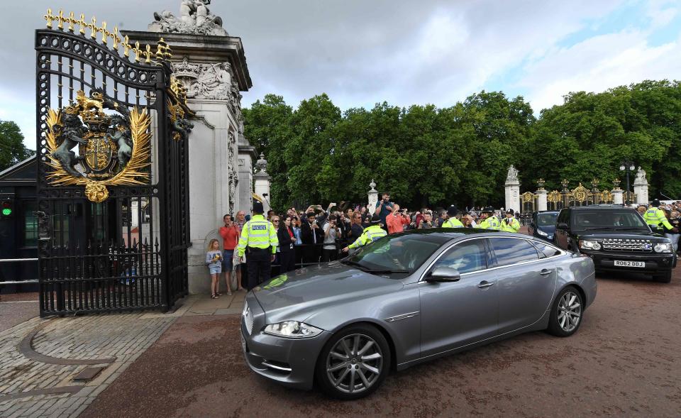  The PM's car then pulled into Buckingham Palace - where she was accompanied by her husband