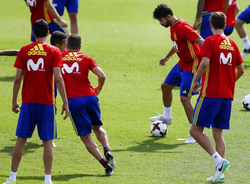  Diego Costa escaped the row over his Chelsea future today as he trained with his Spanish teammates