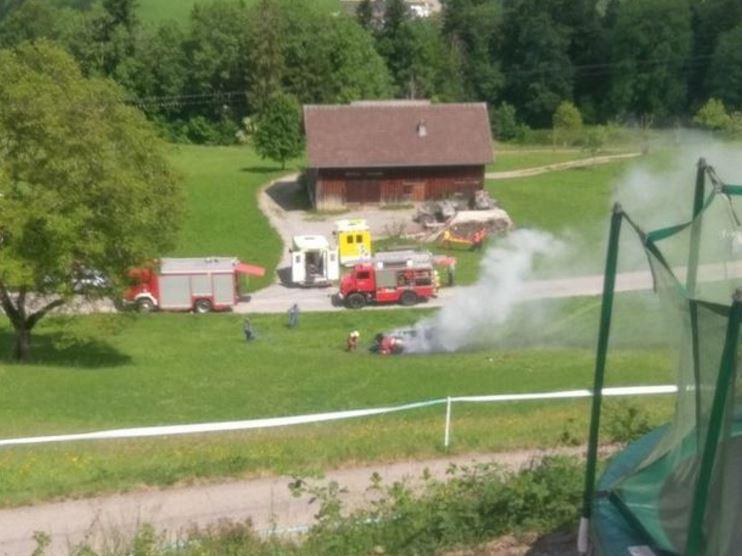  The vehicle was billowing with smoke in the tranquil countryside setting