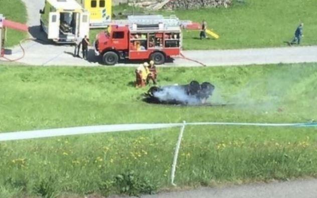  A fire crew douse the wreckage