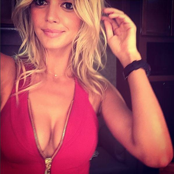  Kelly Rohrbach snaps selfie in CJs iconic red swimsuit