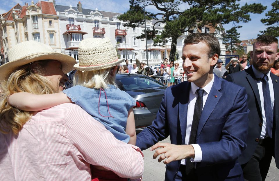  The enigmatic French President shook hands with the public as he left the polling station