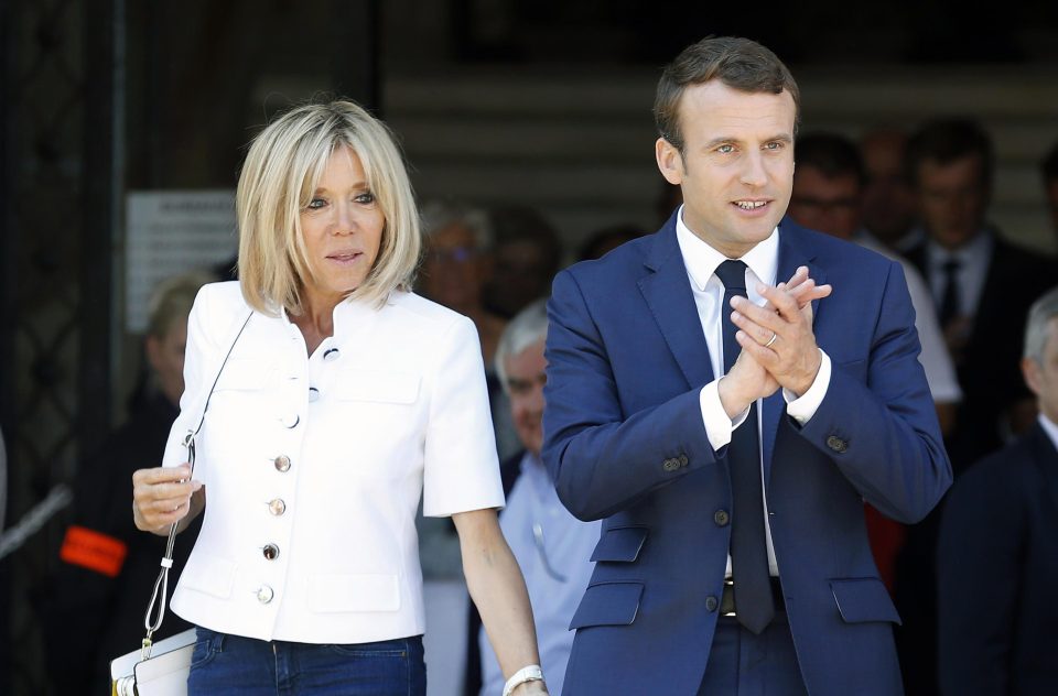  Macron and his wife Brigitte Trogneux leave the polling station of the town hall after casting their vote