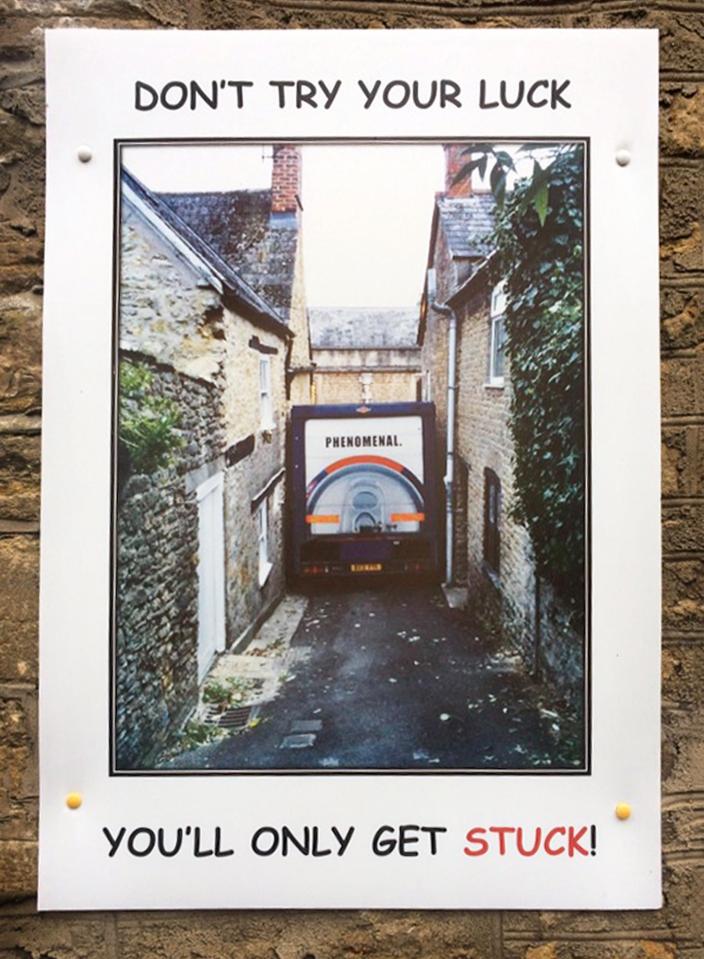  Frustrated residents have erected homemade signs warning lorry drivers they will not fit down narrow lane