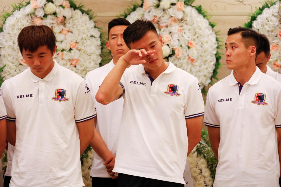  A player sheds a tear at the emotional service in the Chinese captial