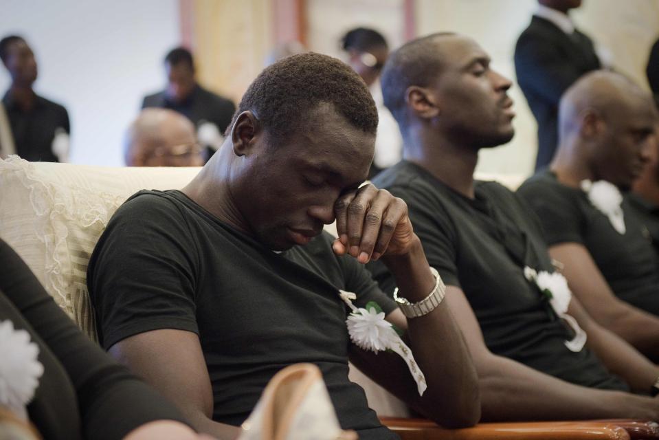  A tearful former Newcastle team-mate Papiss Cisse during the service