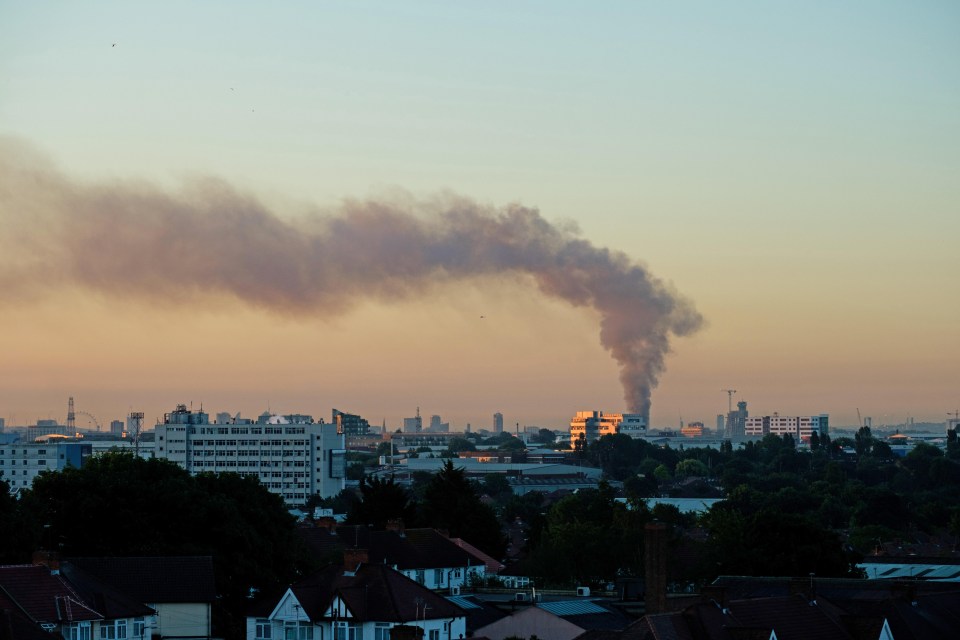 Smoke could be seen drifting across the skies of London this morning from miles away