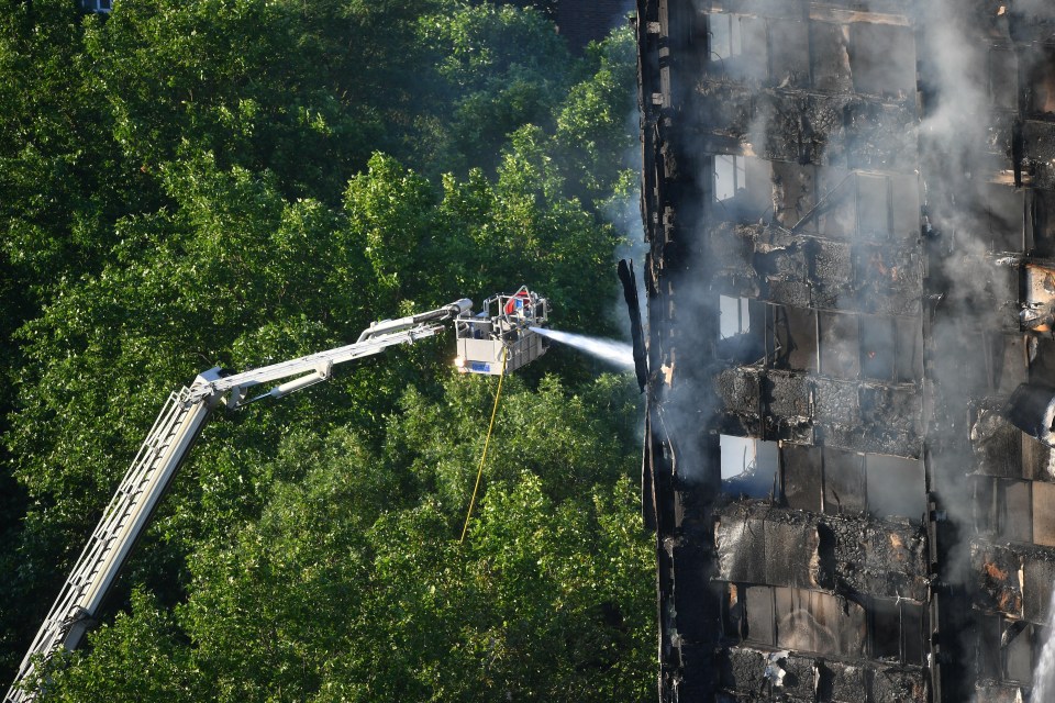 Fire crews on a cherry picker could be seen spraying water into the upper stories of the builing