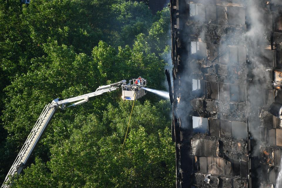  Fire crews on a cherry picker could be seen spraying water into the upper stories of the building