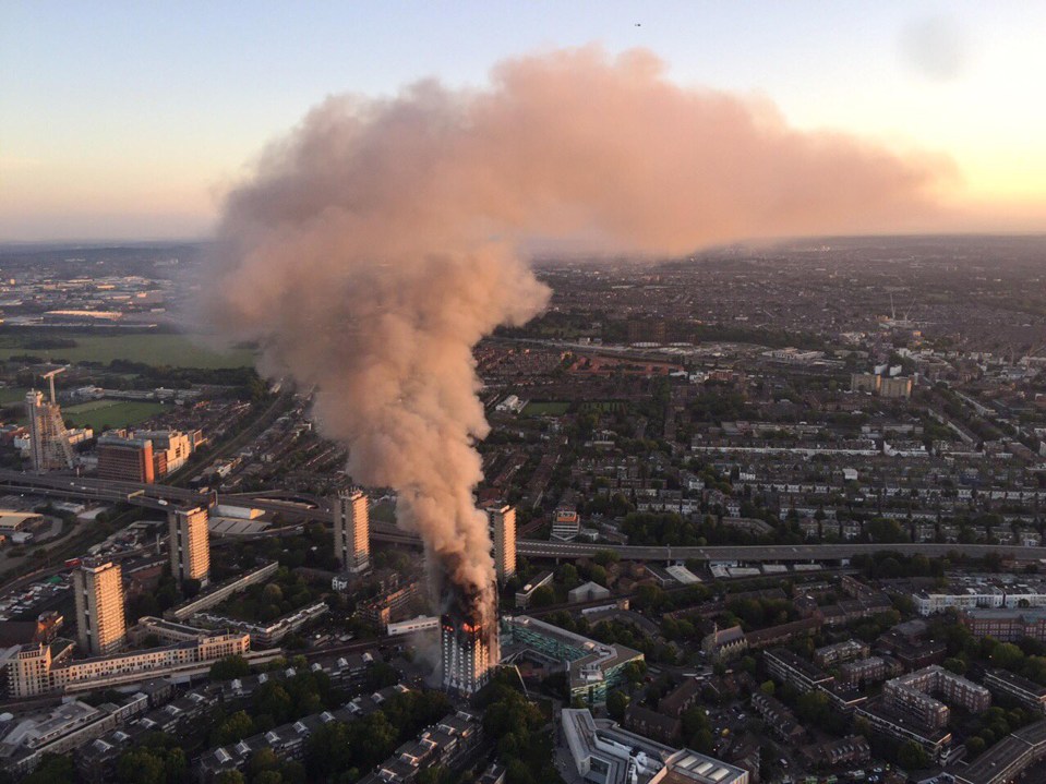 A helicopter circling over London showed smoke billowing into the sky as the sun rose