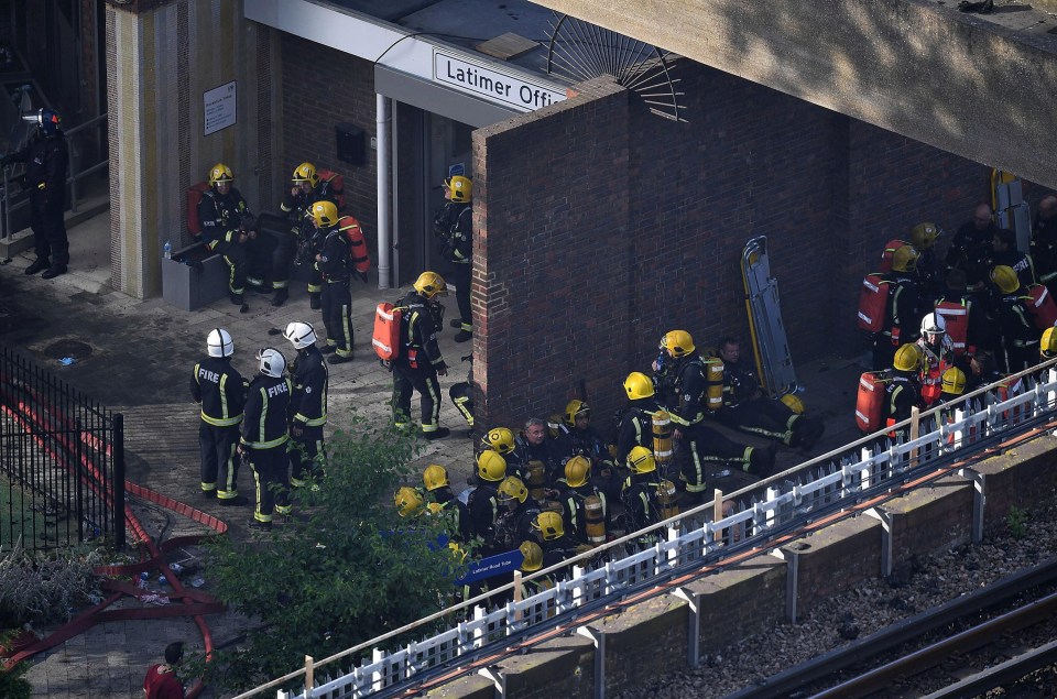 Dozens of firemen gathered at the foot of the building as the continued to battle the blaze