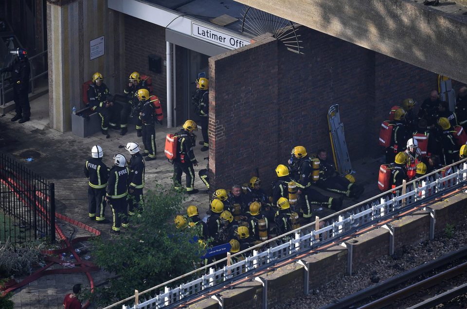  Dozens of firemen gathered at the foot of the building as they continued work this morning