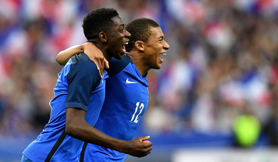  Ousmane Dembele celebrates his winner against England with Kylian Mbappe