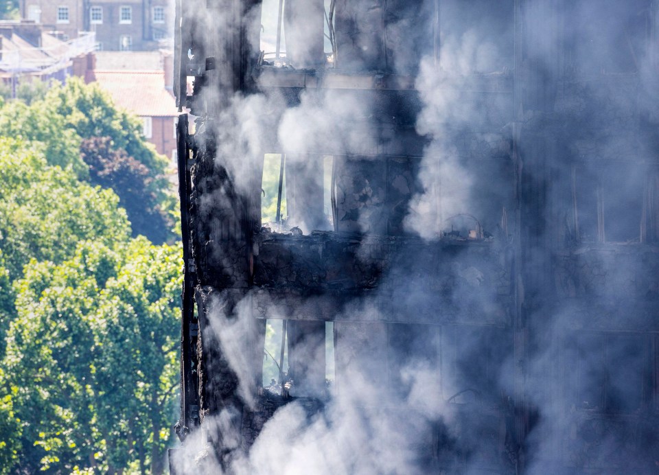 The gutted flats were still smoking as through the morning fire fighters continued to battle the blaze