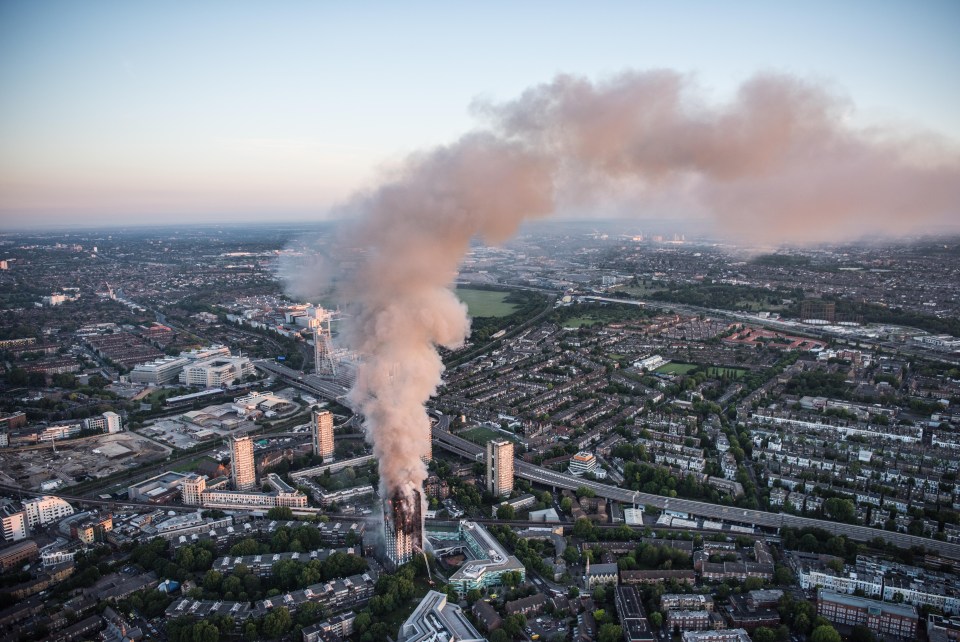 Huge plumes of smoke darkened the skies of West London as 12 people were confirmed dead