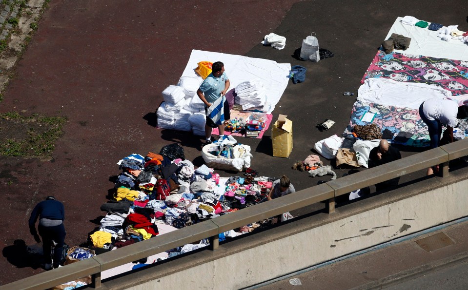 Donated blankets and clothes are collected outside on Latimer Road