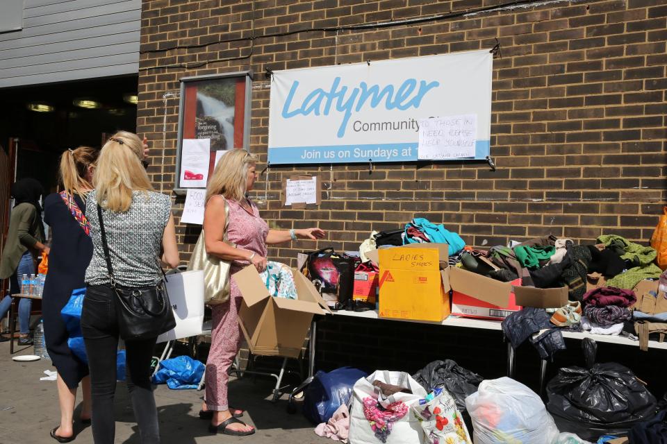  This was the scene outside the Latymer Community Centre where donations of clothes and food were flooding in