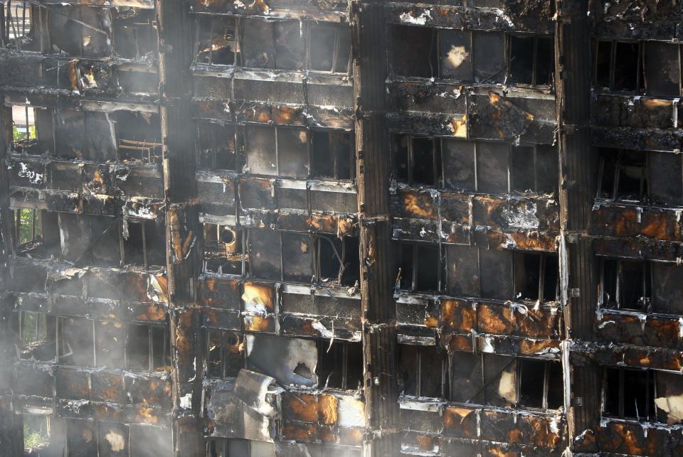  The tower block had been reduced to a burnt-out carcass by this morning