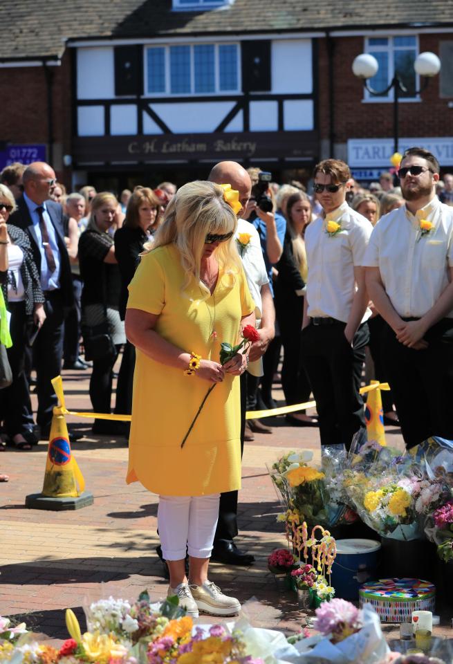  Mum Lesley lays a red rose for her tragic daughter this afternoon