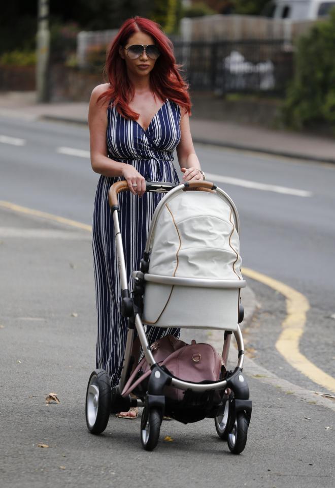  Amy, pictured pushing baby Polly, has ruled out looking for love