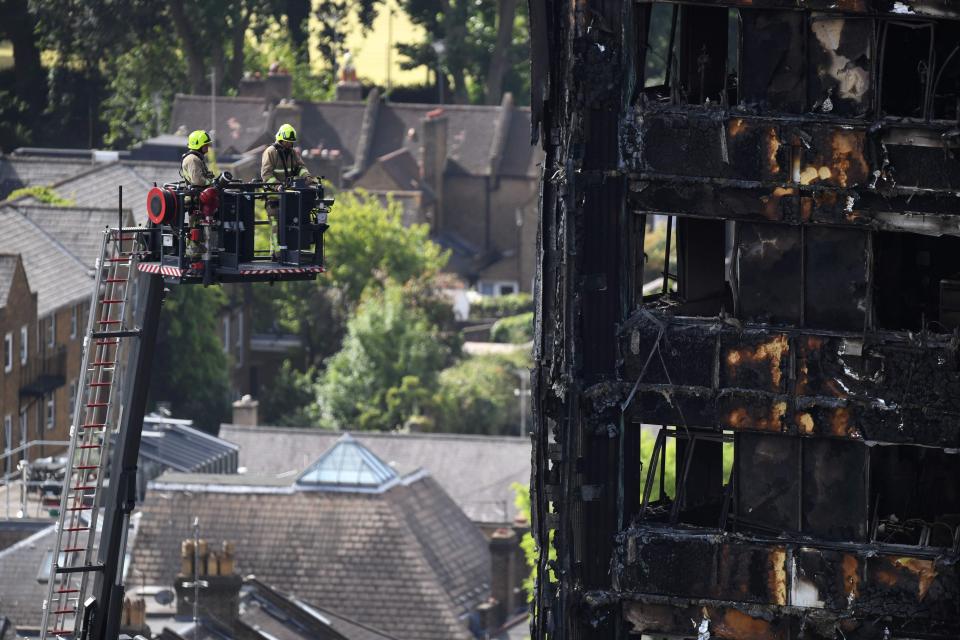  Fire fighters at the scene of the blaze today as work continues