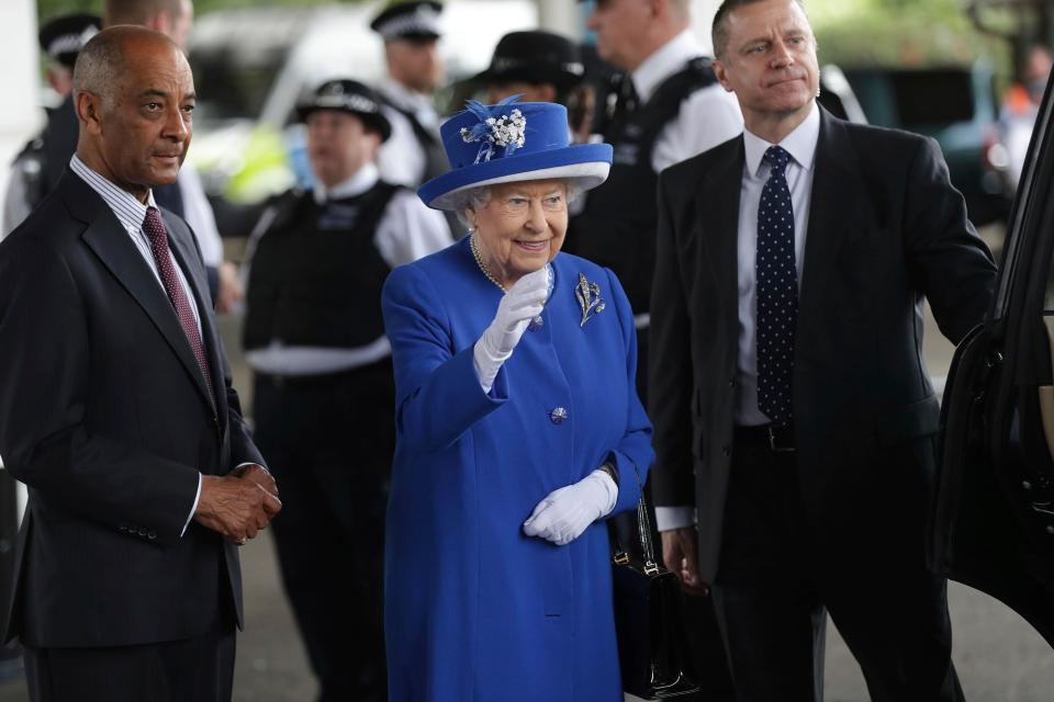  The Queen waves to those at the relief centre in West London