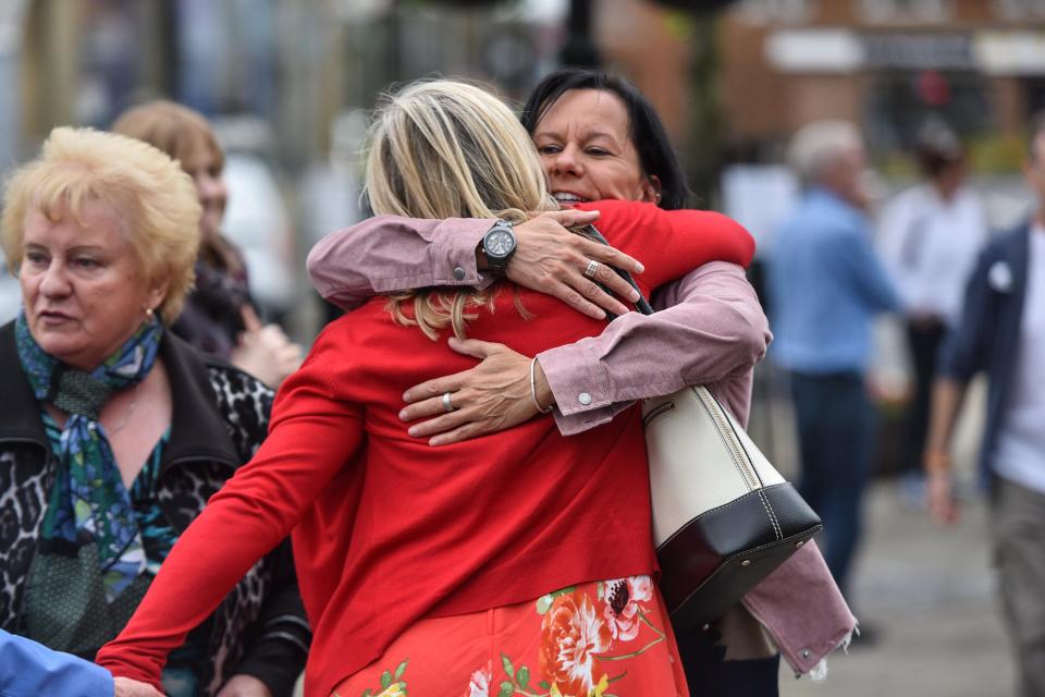  Tracy hugs a constituent on the emotionally-charged anniversary of her death today