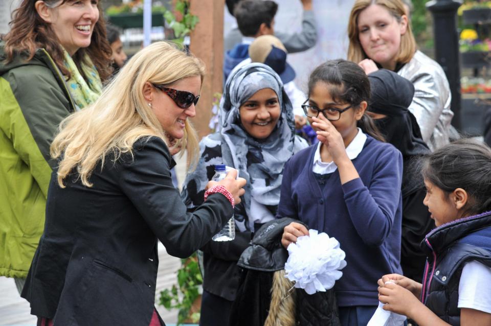  Jo's sister Kim enjoys a light-hearted moment with school children in her sister's home town of Batley this morning