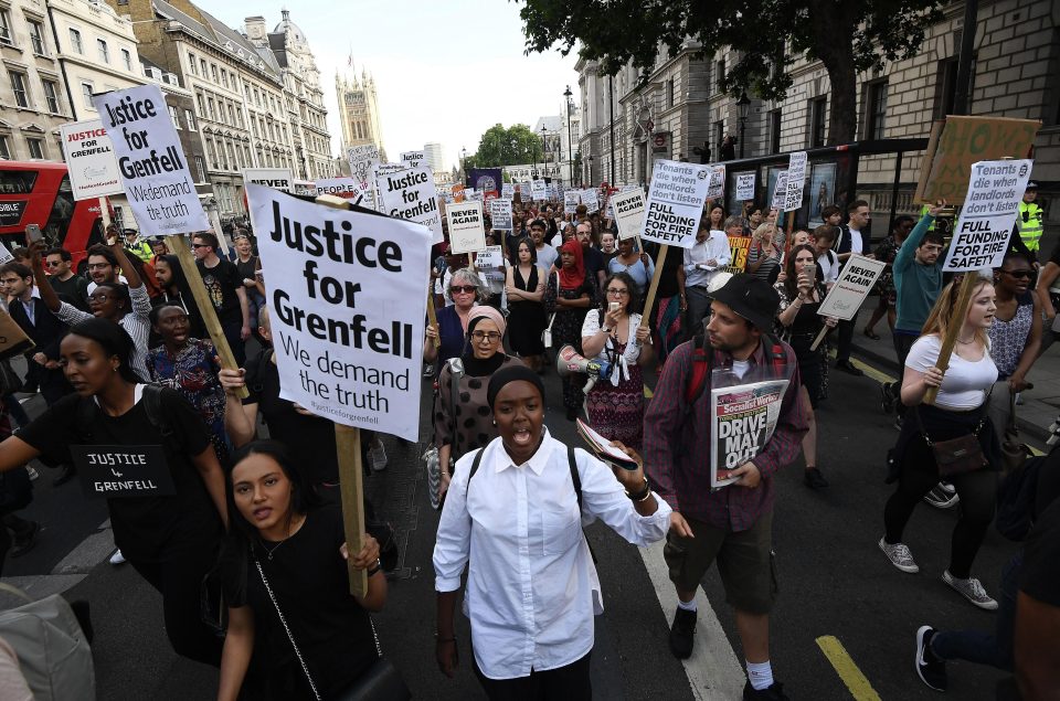  Thousands of angry protesters holding placards calling for 'Justice for Grenfell' marched on Whitehall today as they demanded answers over the disaster