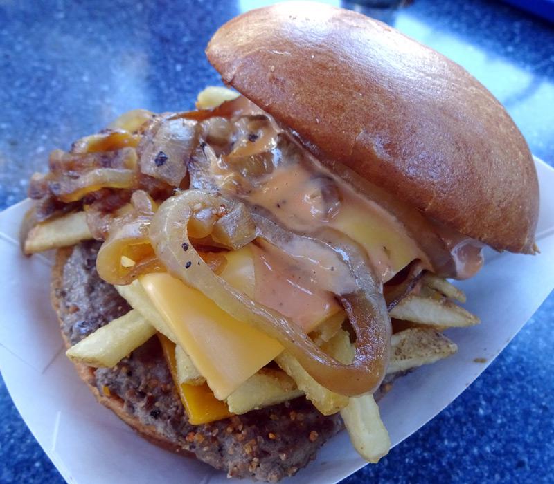  This "Galactic style burger" is topped with chips, bacon, cheese grilled onions and Thousand Island dressing you can order this (on the sly) at the Galactic Grill in Tomorrowland