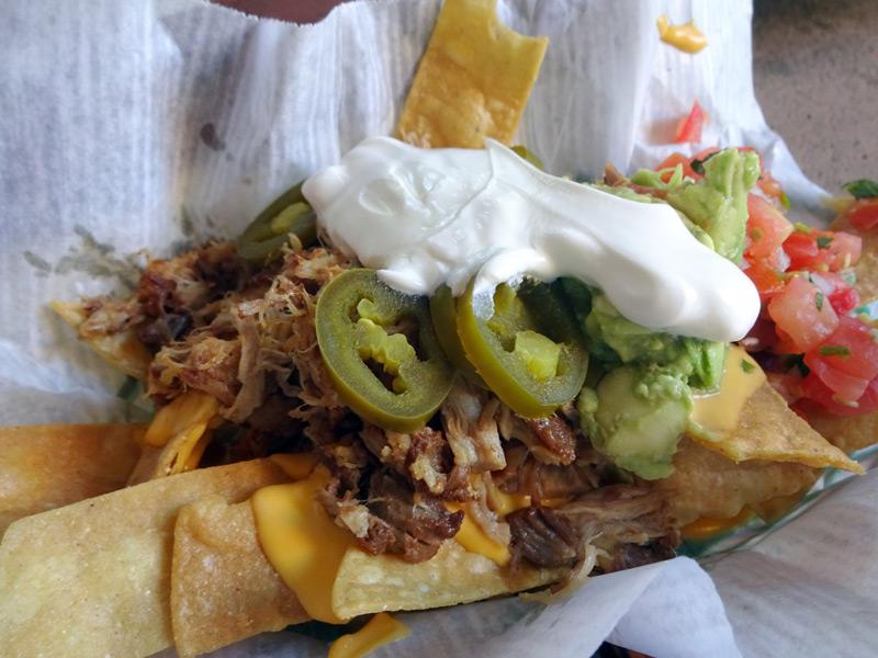  Head over to Whitewater snacks and whisper that you want "the secret menu item" in your waiter's ear - they'll bring you this pork and avocado nacho plate... you're welcome