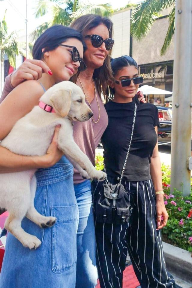  The trio pose for a snap with a pooch