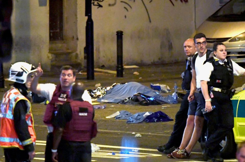  A body lies covered in the street after the van attack in North London