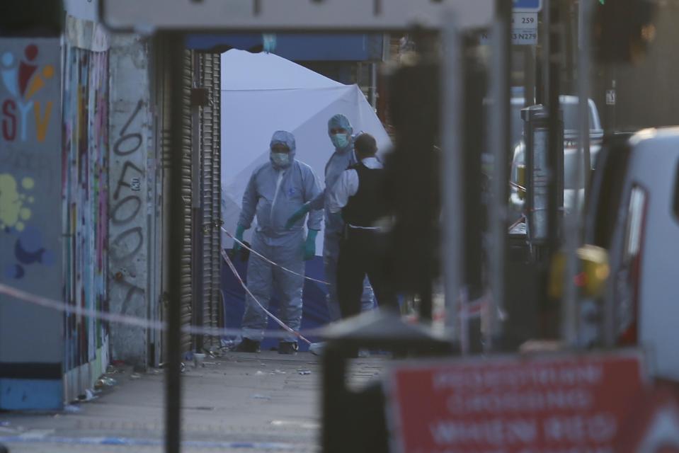  Forensic teams arrived at the scene of the attack today with tents set up in the street