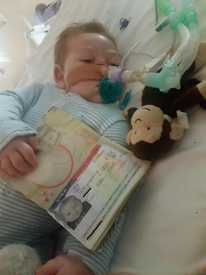  Charlie was pictured holding his passport as his parents hope to take him to the United States for treatment