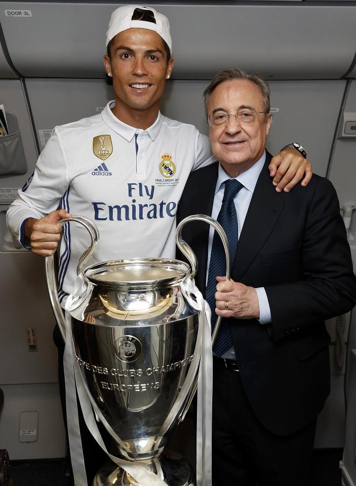  Cristiano Ronaldo and Florentino Perez celebrate Champions League trophy