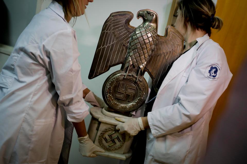  A statue of the Nazi eagle perched on a swastika