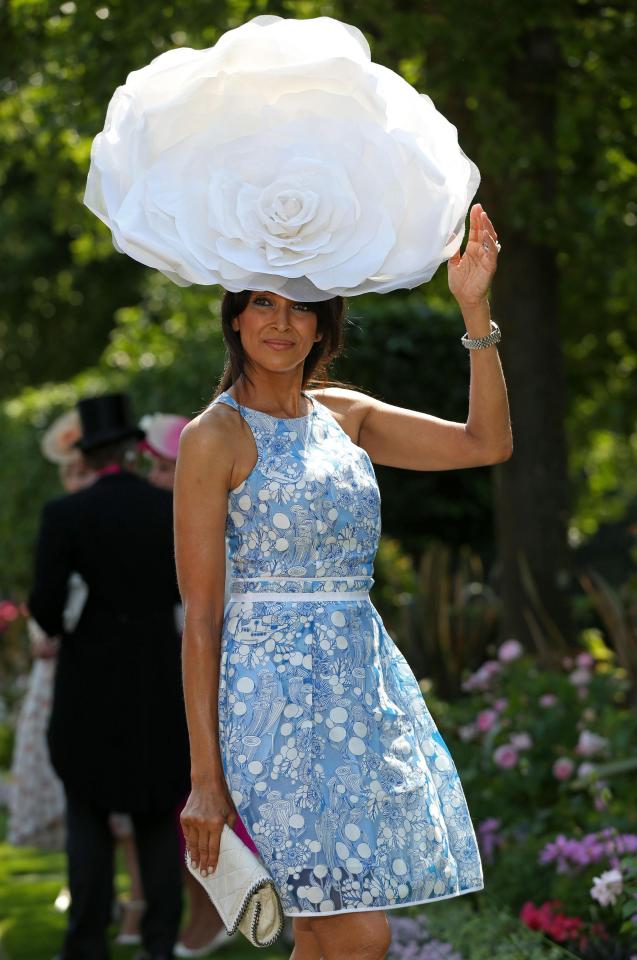  All eyes were on one reveller's enormous white rose hat, which she had to hold to keep in place