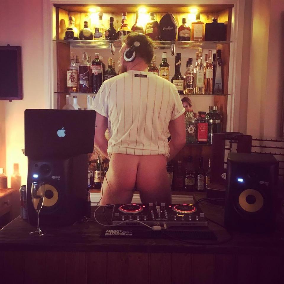  A DJ takes a break from spinning the decks to drop his kecks