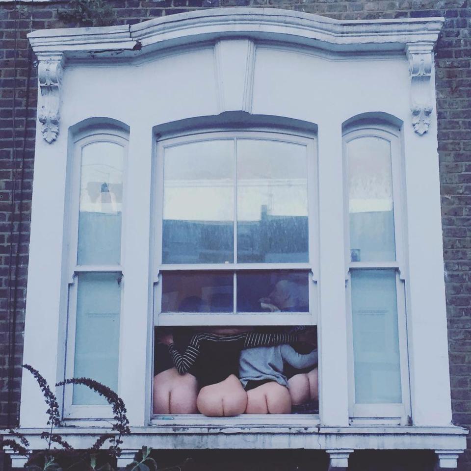  Four friends force their bottoms into the frame at a London flat