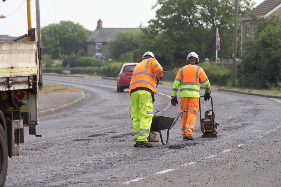  And in Doddington, Cambridgeshire, workmen were out mending road surfaces that melted in the 31C heat