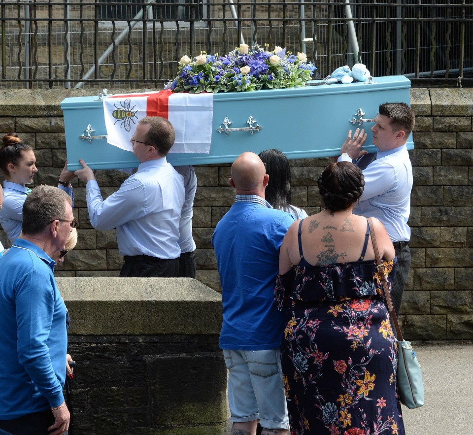 Her heartbroken mum and stepdad look on as Olivia’s coffin is carried past them into the church