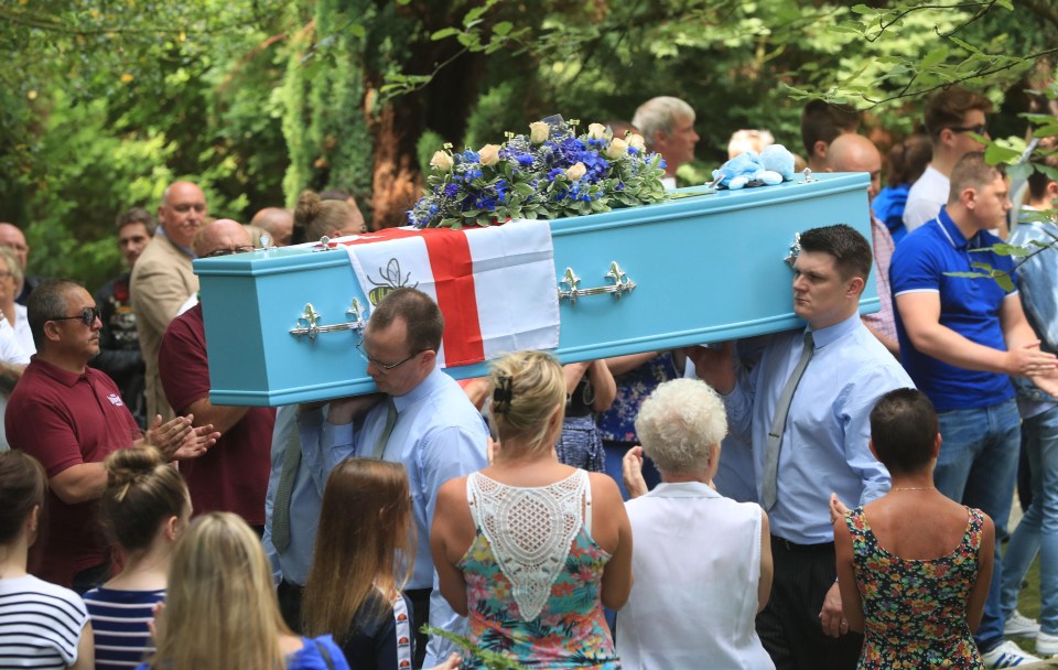 The blue coffin was decorated with flowers and an England flag with a worker bee on it