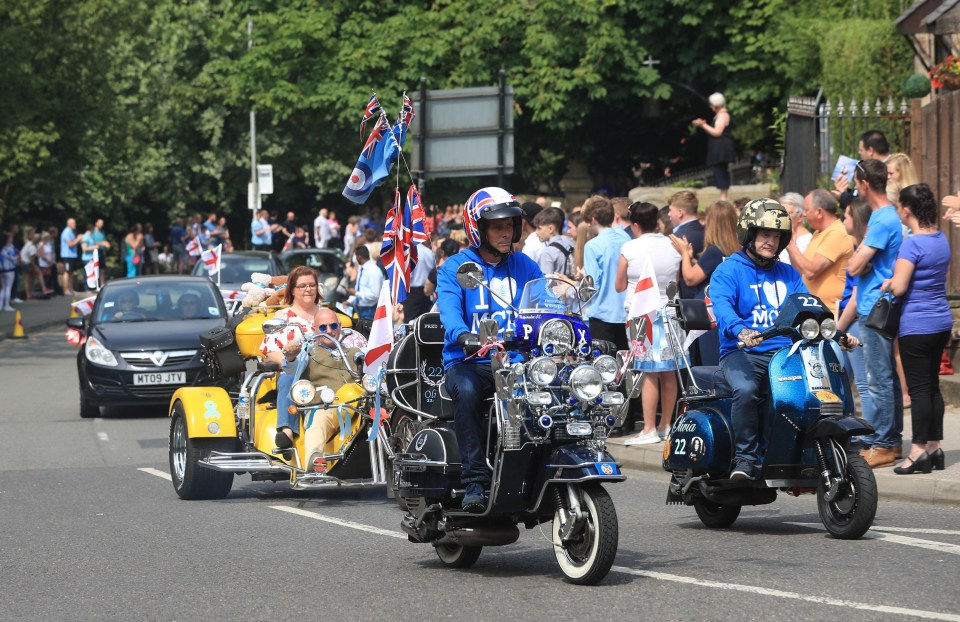 Brightly coloured vehicles were ridden behind the hearse as family members requested mourners were blue or bright colours