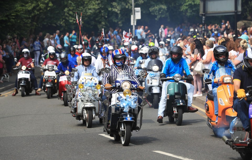 A group of scooters were ridden behind the hearse as hundreds of people arrived to pay their respects