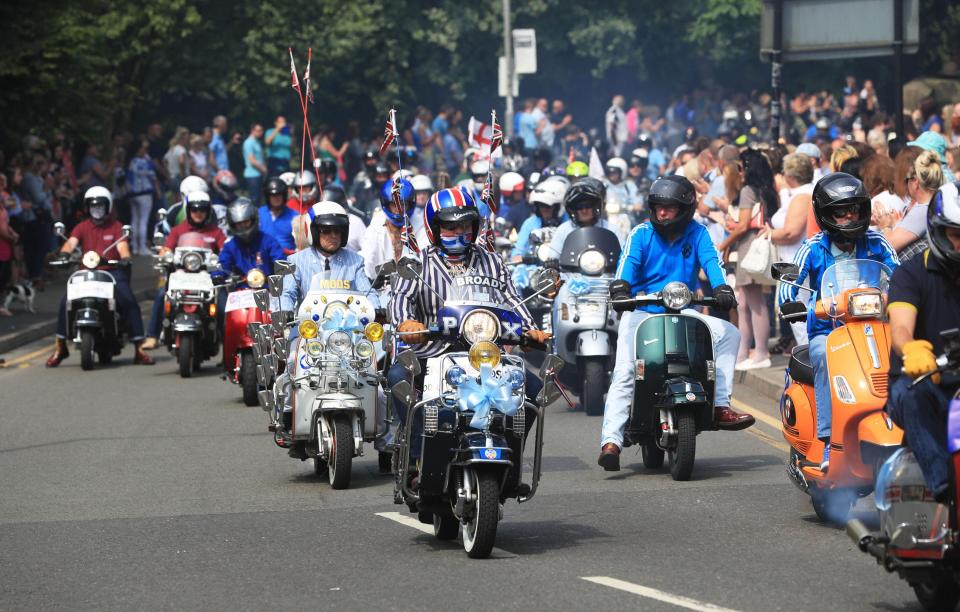  A group of scooters were ridden behind the hearse as hundreds of people arrived to pay their respects