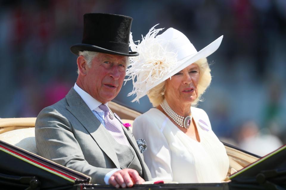  Prince Charles arrived in a black top hat, while Camilla Parker-Bowles opted for a summer-appropriate all-white outfit