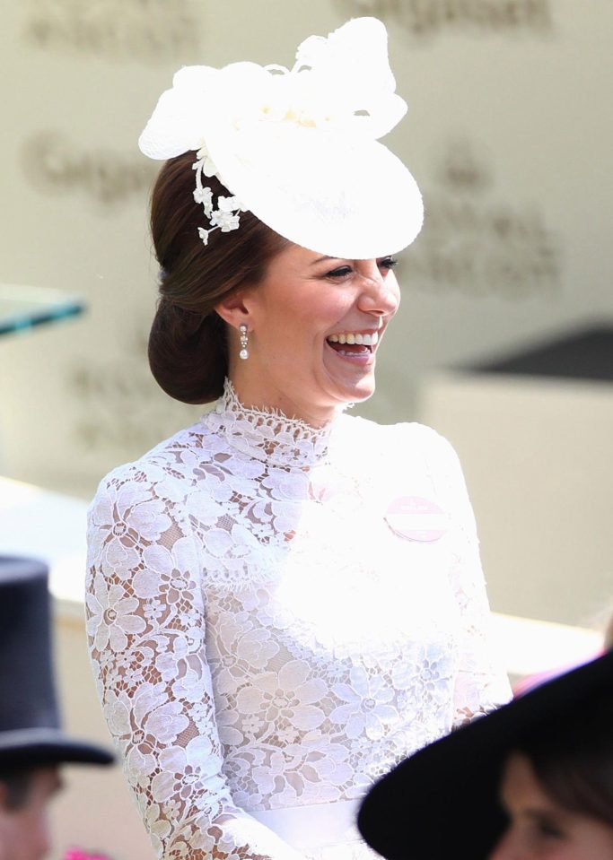  Thr Duchess of Cambridge wowed in a white lace high-necked dress and matching hat as she arrived at Royal Ascot today