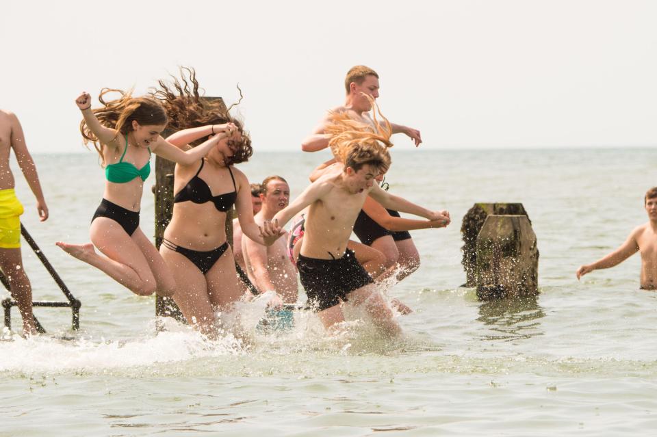  Youngsters leap into the sea in Aberystwyth, Wales, to keep cool in the heatwave conditions today